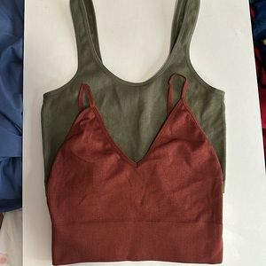 Two tank tops one green, one red